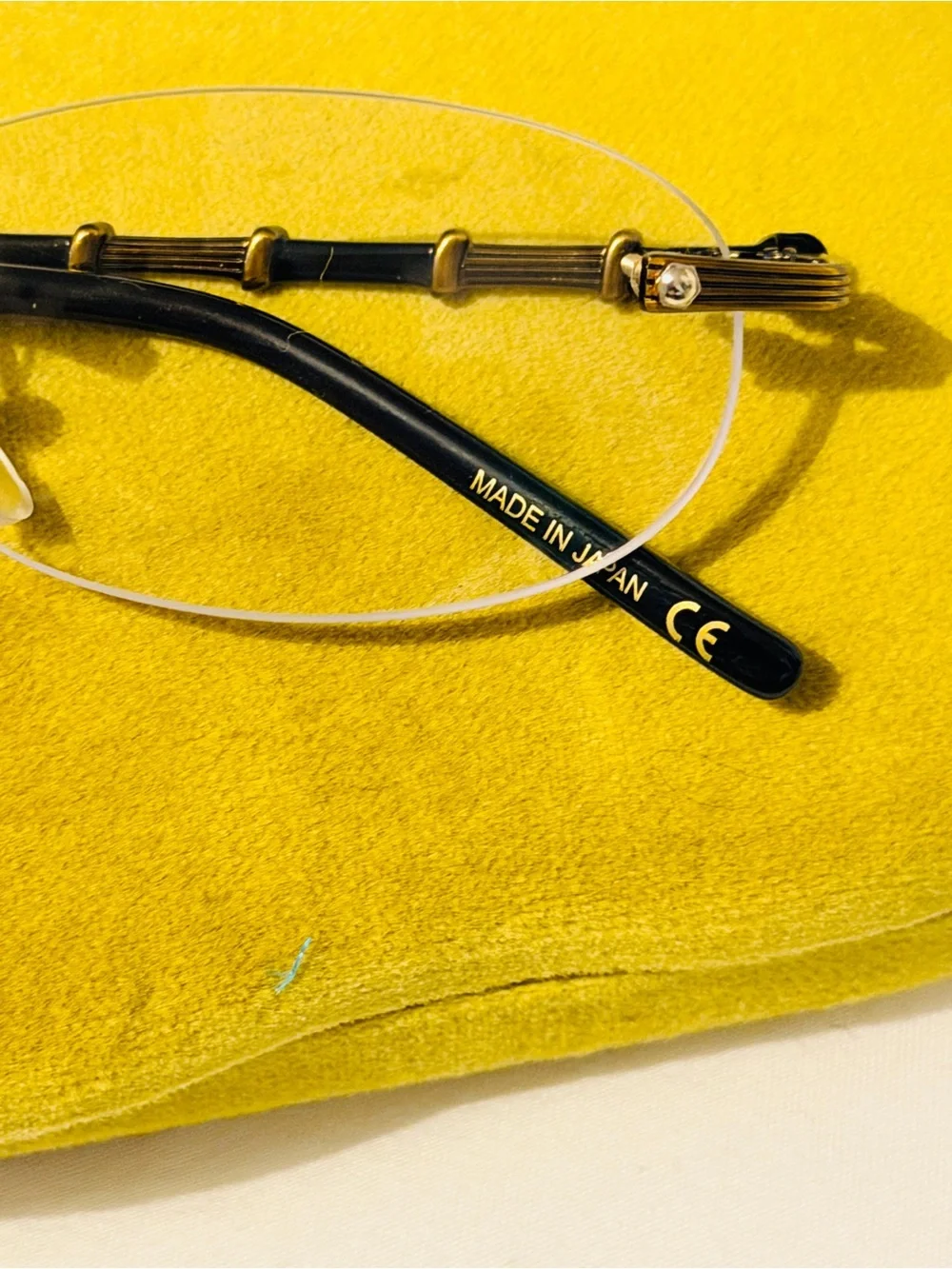Gucci Rimless Men's Glasses in Black and Gold Accents